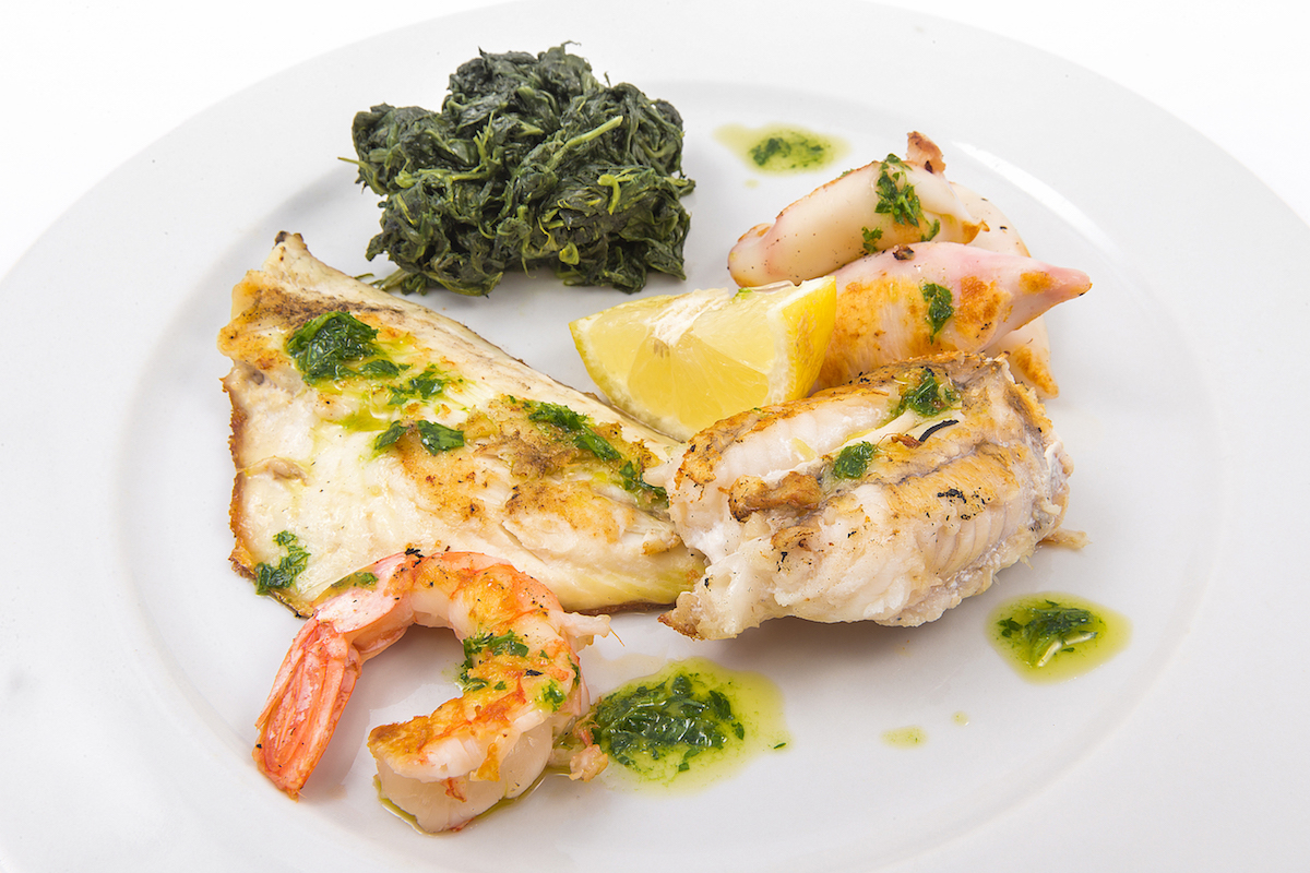 Grilled prawns or calamari with butter spinach
