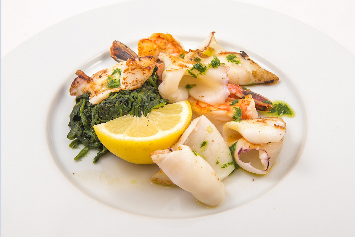 Grilled mixed fish (prawns, squid, monkfish and fish fillet) with buttered spinach